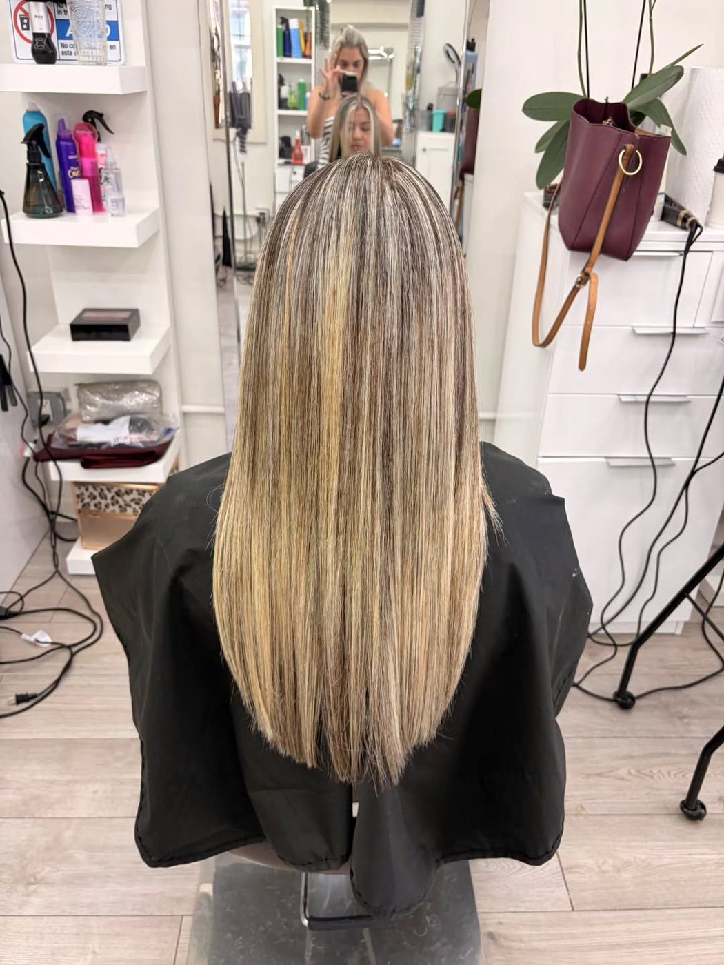 Long straight hair with blended blonde highlights