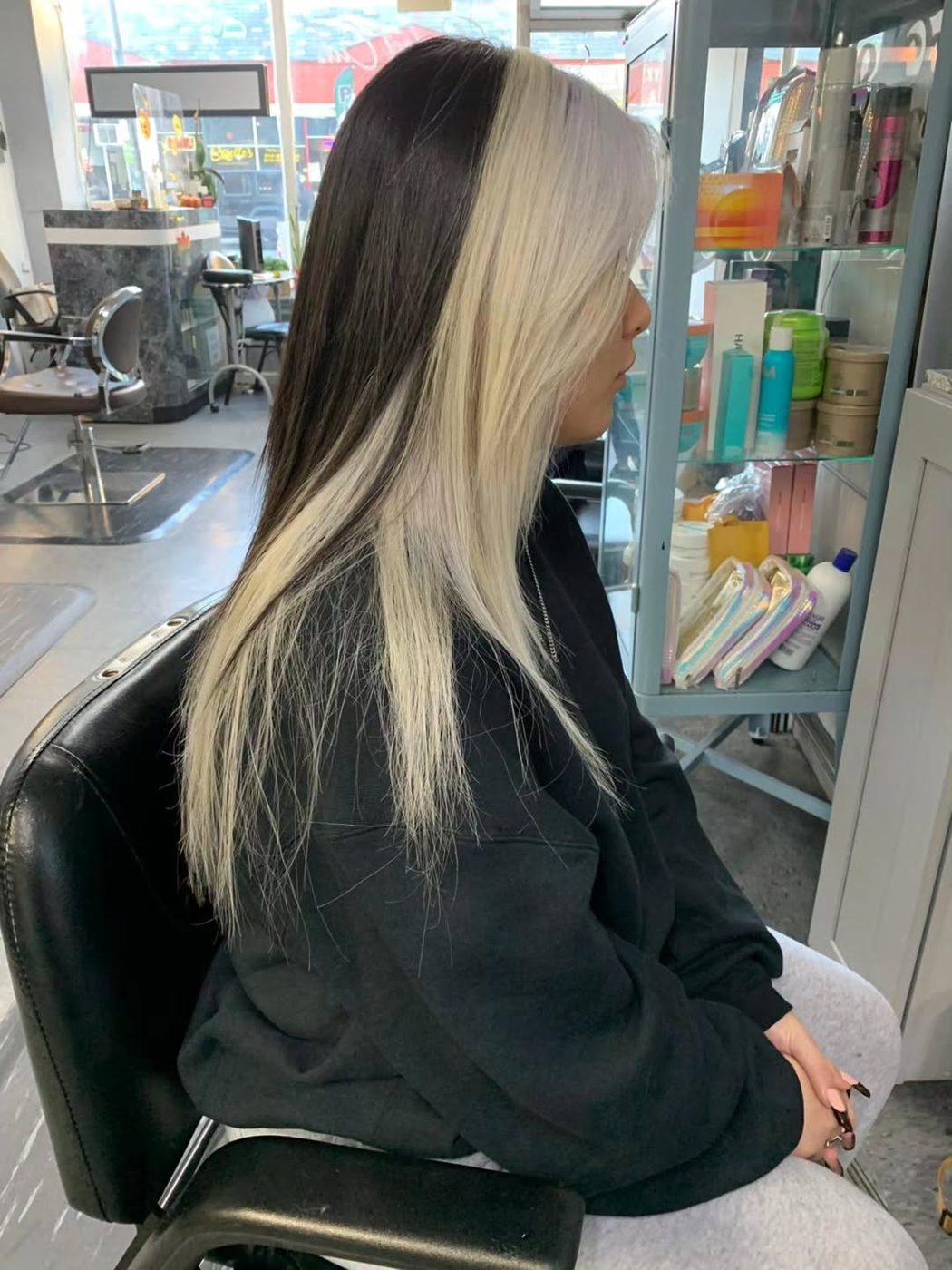 Long straight hair with a two-tone platinum and black color